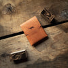 Stitchless Buck leather wallet by Hound Valley Goods in Olmo Pueblo leather on wooden background
