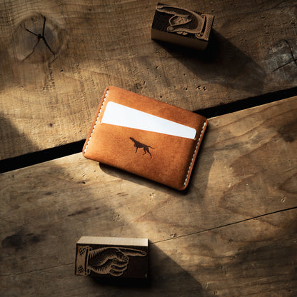 Sirius wallet from Hound Valley Goods in Olmo Pueblo with white thread on wood background